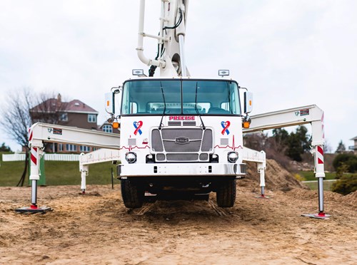 The ACX concrete pumper at work on a construction site. 